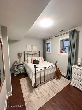 Chicago apartment for rent - a bedroom with a bed and a nightstand
