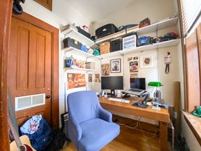 Chicago apartment for rent - A small room with a desk and a chair.