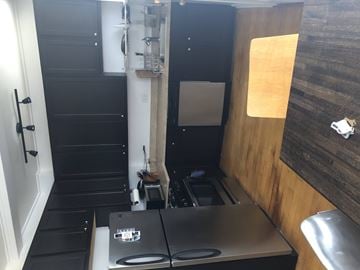 Chicago apartment for rent - A small kitchen with a stove top oven and a sink.