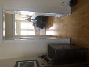 Chicago apartment for rent - A room with a wooden wall and a window.