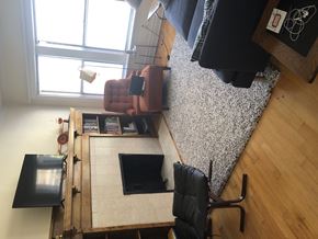 Chicago apartment for rent - A room with a desk, chair, and a laptop.