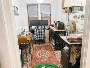 Chicago apartment for rent - a small room with a kitchen and a tv
