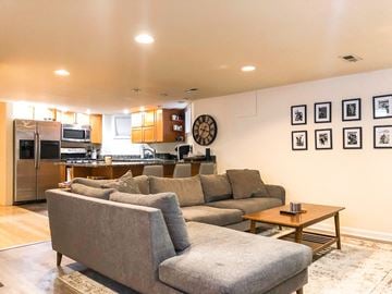 Chicago apartment for rent - A living room with a grey couch and a coffee table.