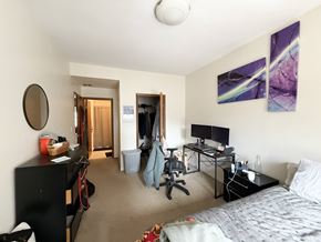 Chicago apartment for rent - A bedroom with a bed, desk, and chair.