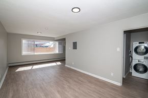 Denver apartment for rent - A laundry room with a washer and dryer in it.