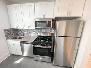 Chicago apartment for rent - A kitchen with a stove, oven, and refrigerator.