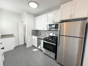 Chicago apartment for rent - A kitchen with a stove, oven, and refrigerator.