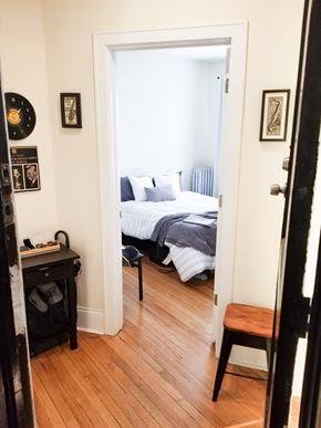 Chicago apartment for rent - A bedroom with a bed, a desk, and a chair.