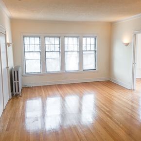 Evanston apartment for rent - A room with a wooden floor and a window.