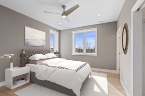 Chicago apartment for rent - a bedroom with a bed and a ceiling fan