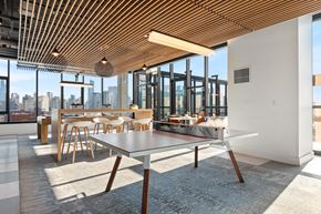Chicago apartment for rent - A modern dining area with a long table and chairs.