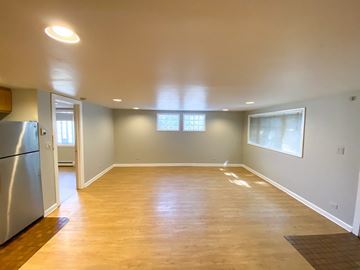 Chicago apartment for rent - A kitchen with a refrigerator and a window.