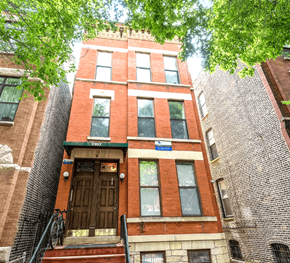 Chicago apartment for rent - a tall brick building with a wooden door