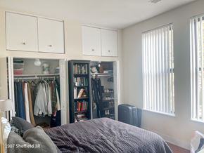 Chicago apartment for rent - A bedroom with a bed, a wardrobe, and a bookshelf.