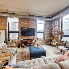 Chicago apartment for rent - A living room with a brick wall and a flat screen TV.