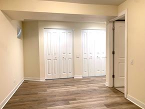 Chicago apartment for rent - a living room with wood floors and white doors