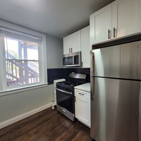 Chicago apartment for rent - A kitchen with a stove, oven, and refrigerator.