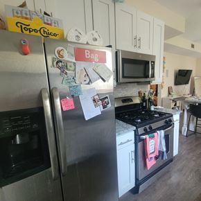Chicago apartment for rent - A refrigerator with a bag magnet on it.