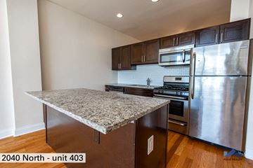 Chicago apartment for rent - an updated kitchen with stainless steel appliances and granite counter tops