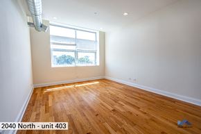 Chicago apartment for rent - the living room of a home with wood floors and a window