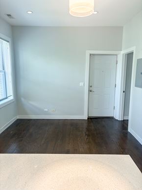 Chicago apartment for rent - A room with a white door and a window.