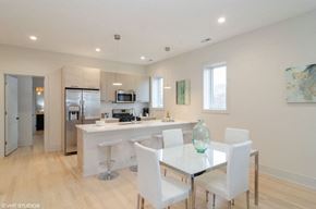 Chicago apartment for rent - A modern kitchen with a dining table and chairs.