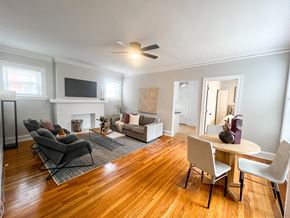 Evanston apartment for rent - A living room with a fireplace and a television.