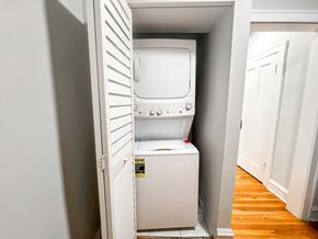 Evanston apartment for rent - A white dishwasher is open in a kitchen.