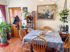 Chicago apartment for rent - A dining room with a floral tablecloth and wooden chairs.
