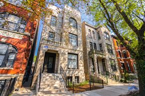 Chicago apartment for rent - a row of town houses with trees in front of them