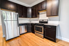 Chicago apartment for rent - A kitchen with a refrigerator, oven, and stove.