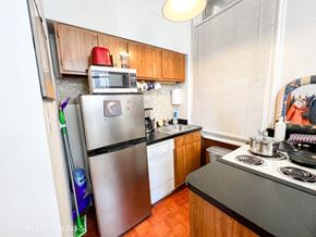 Chicago apartment for rent - A kitchen with a stove, refrigerator, and dishwasher.