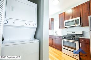 Chicago apartment for rent - A white dishwasher is on the left and a white oven is on the right.