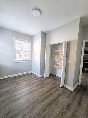 Chicago apartment for rent - A kitchen with a refrigerator and a window.