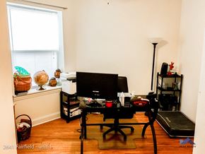 Chicago apartment for rent - A room with a desk, chair, and computer monitor.