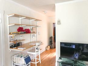 Chicago apartment for rent - A white chair is in front of a desk with a computer on it.