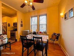 Chicago apartment for rent - A dining room with a table set for two and a fan on the ceiling.