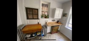 Chicago apartment for rent - A small room with a table and a window.