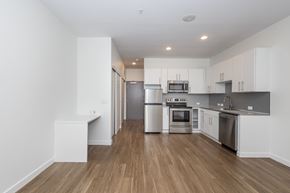 Denver apartment for rent - A kitchen with a refrigerator, oven, and microwave.