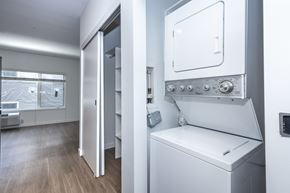 Denver apartment for rent - A white washing machine in a modern laundry room.