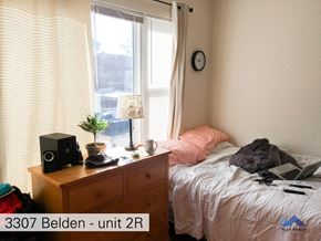 Chicago apartment for rent - a bedroom with a bed and a dresser and a window