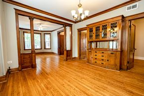 Chicago apartment for rent - A large room with wooden floors and furniture.