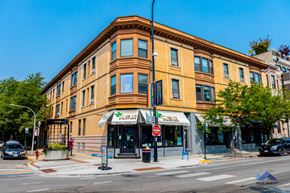 Chicago apartment for rent - a large brick building on the corner of a city street