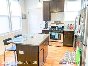 Chicago apartment for rent - a kitchen with stainless steel appliances and a granite counter top