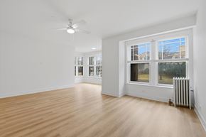 Evanston apartment for rent - A room with a window and a fan.