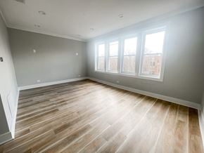 Chicago apartment for rent - A room with wooden flooring and a window.
