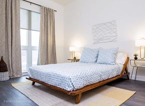 Chicago apartment for rent - a bedroom with a bed and a window