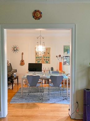 Chicago apartment for rent - A room with a piano and a dining table with chairs.