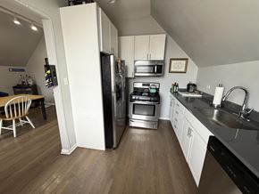 Chicago apartment for rent - A kitchen with a white refrigerator, stove, and oven.