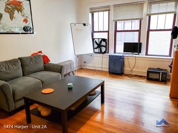 Chicago apartment for rent - a living room with a couch and a coffee table